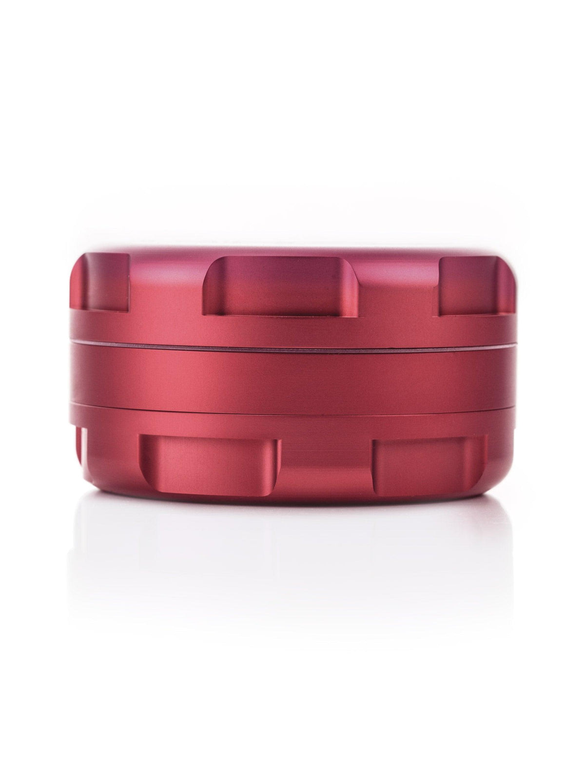Side view of closed GRAV 3-piece grinder in blush red anodized aluminum, 1.25 inch, on white