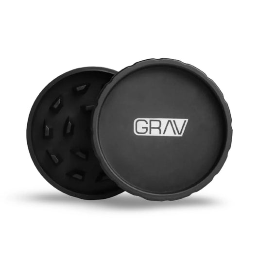 GRAV hemp plastic 2-piece grinder, black, open to show toothed grinding chamber and logo lid on white