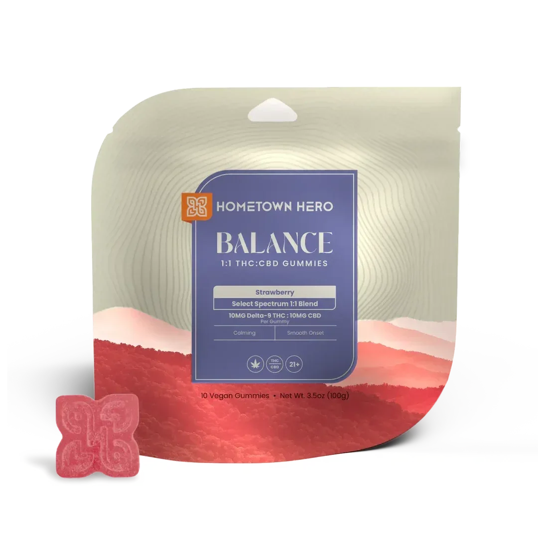 Pack of Hometown Hero Balance Strawberry 1:1 THC:CBD gummies, 10mg THC and 10mg CBD each, with a single red gummy