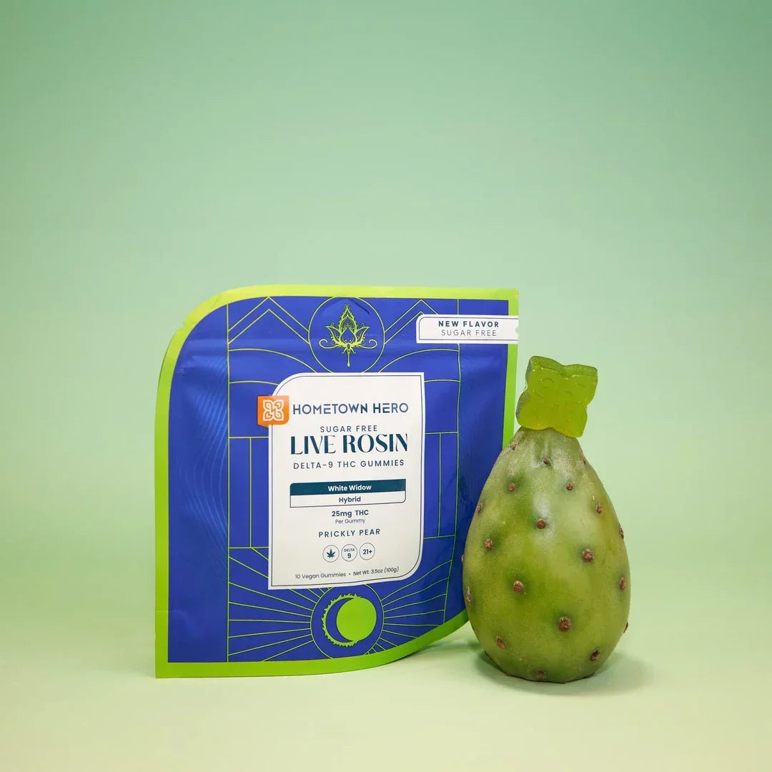 Hometown Hero Prickly Pear White Widow Live Rosin THC gummies pouch beside a whole prickly pear fruit